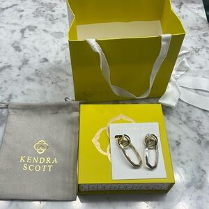 Kendra Scott gold and silver dangly earrings